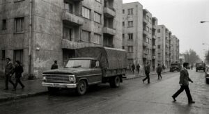 Muted street scene in Santiago with a 1970s-style delivery truck and period architecture.