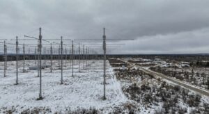 Aerial view of a large HF antenna array and tundra at a remote Alaska research site.
